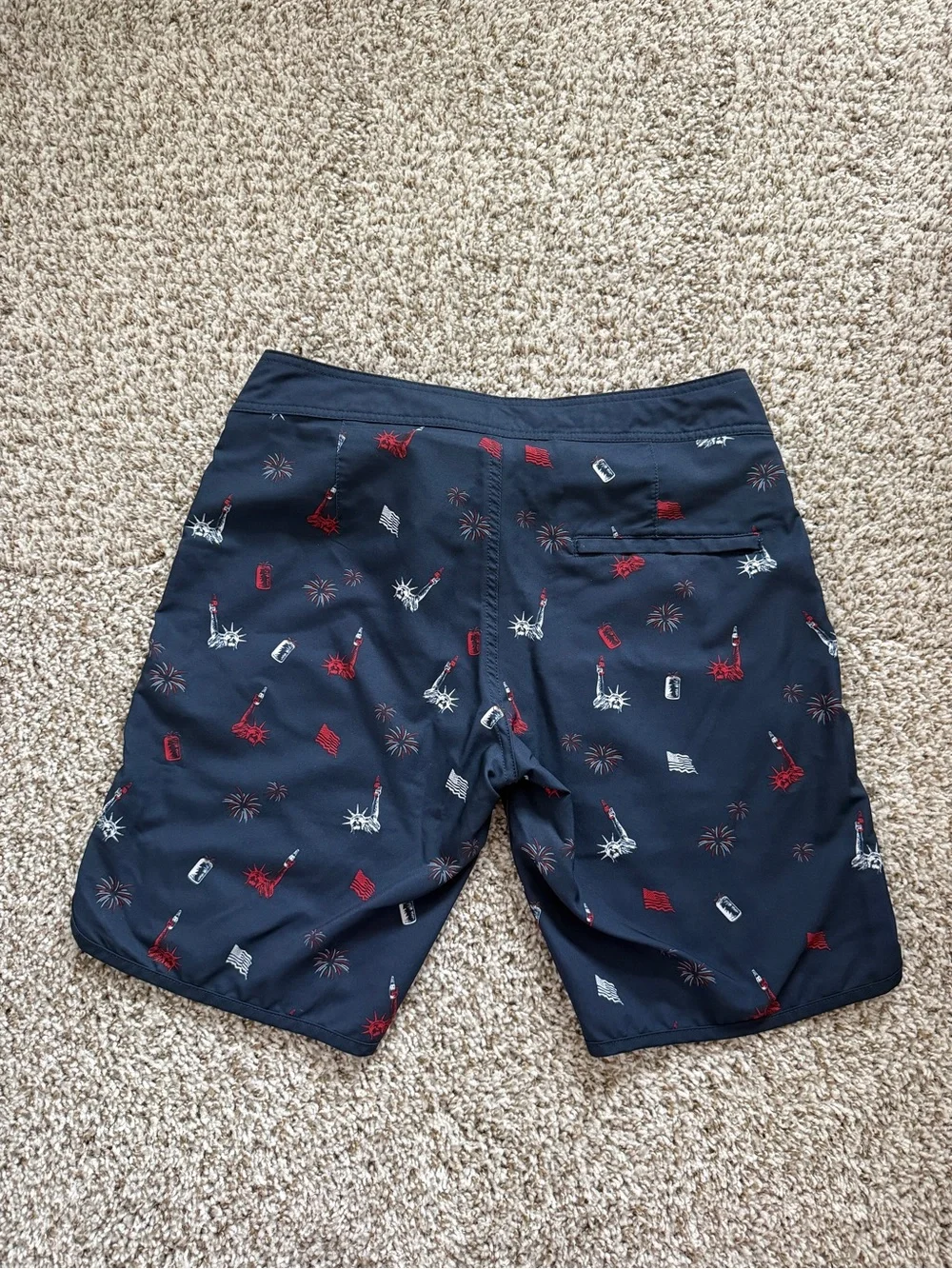 Travis Mathew Navy Swim Shorts with Red & White Liberty Icons